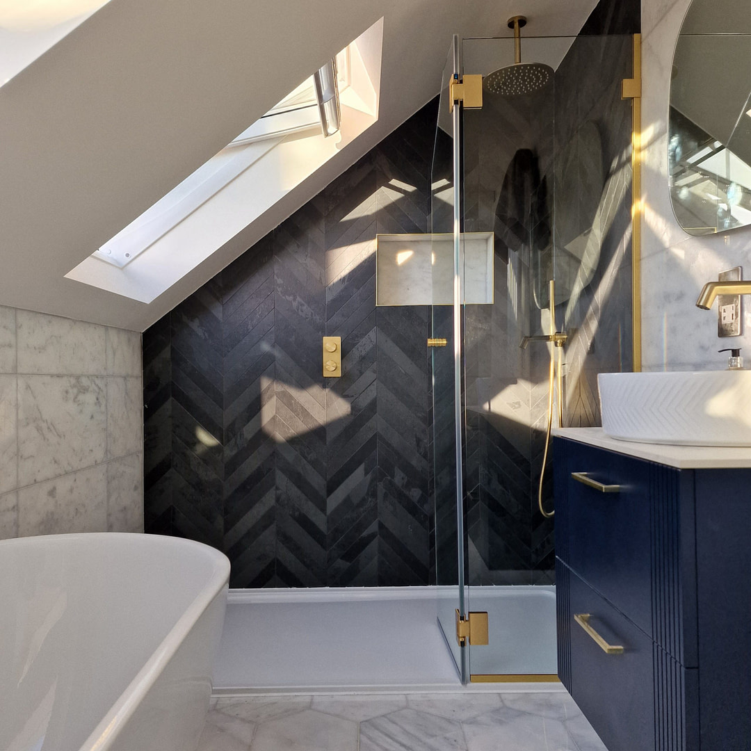 A bathroom with a skylight and a blue cabinet. The skylight illuminates the room, adding a natural touch. The blue cabinet adds a pop of color to the space.